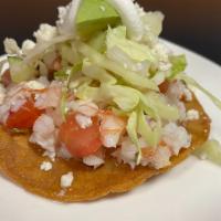 Tostadas (2) (Seafood) · Shrimp and crab with cabbage slaw, avocado, sour cream and queso fresco, piled high on crisp...