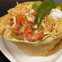 Taco Shell Salad · A crispy tortilla shell,  your choice of beef, chicken, pork, jalapeños, sour cream, guacamo...