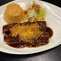 Chicken Enchiladas · Two corn tortillas stuffed with seasoned chicken baked, topped with house made enchilada sau...