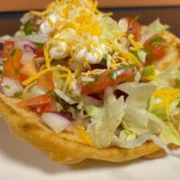 Chalupa · Deep fried pita bread,  filled with choice of meat and refried beans topped with lettuces,so...