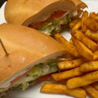 Torta  · Mexican white bread sandwich, made with choice of meat, refried beans, lettuce, tomatoes, gr...