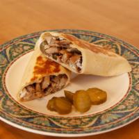 Shawarma Chicken Wrap · With garlic sauce, and pickles.