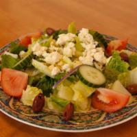 Greek Salad  · Romaine lettuce, tomatoes, cucumber, feta cheeses, kalamata olives, red onions, and Greek sa...