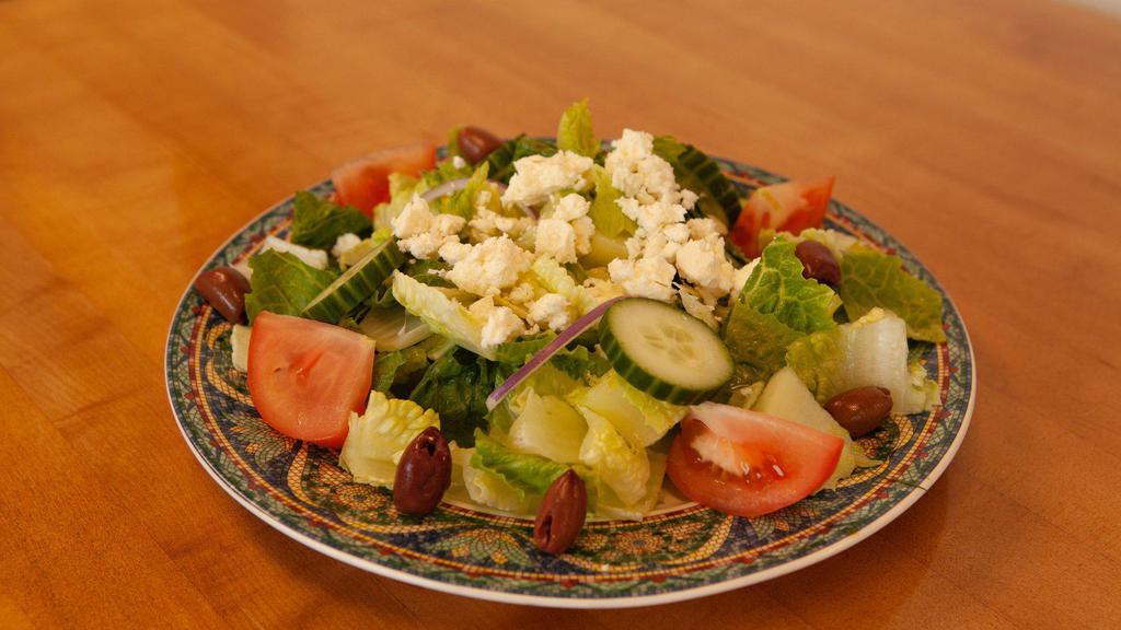 Greek Salad  · Romaine lettuce, tomatoes, cucumber, feta cheeses, kalamata olives, red onions, and Greek salad dressing.