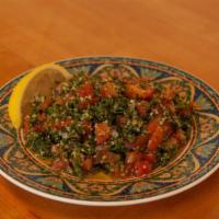 Tabouli Salads · Finely chopped parsley, tomatoes, onion, cracked wheat mixed with lemon juice, salt, and oli...