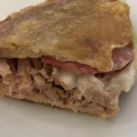 Lechon Jibaritos · Baked pork plantain sandwich - includes lettuce, tomato, mayo,  cheese, adobo seasoning,  an...