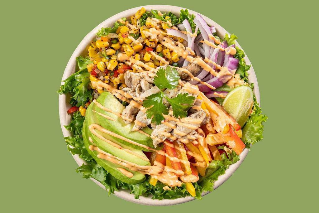 Southwest Chicken Salad · *LIMITED TIME* roasted chicken, avocado, sweet peppers, red onion, + roasted corn ensalada on a bed of lettuce, topped w/ CHIPOTLE mayo, diced cilantro, FUEGO crunch, + served w/ a lime wedge!