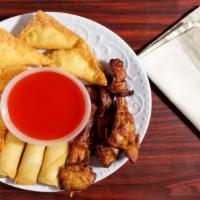Pu Pu Platter (For 2) · Two Egg roll, two teriyaki beef, two chicken wings, two Bar-b-q spare ribs, two crab rangoon...