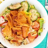 Fattoush · Cucumbers, tomatoes, lettuce, radish, and green onions. Topped with fried pita bread dressin...
