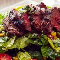 Char-Grilled Steak · Romaine and arugula, grilled asparagus, roasted corn, grape tomatoes, bleu cheese, cilantro-...