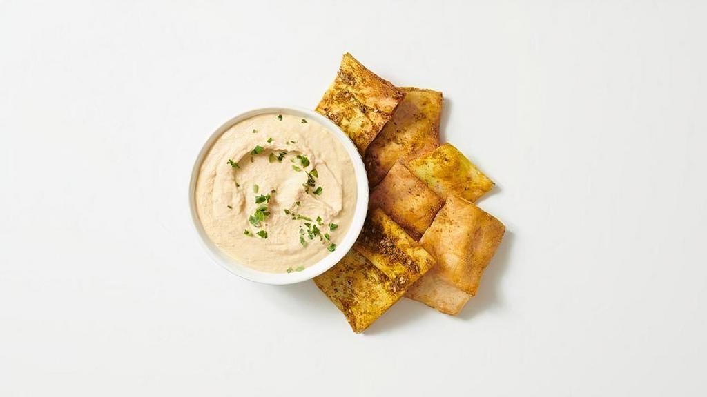 - Pita Chips & Spread · Freshly Baked Pita Chips with Za'atar Seasoning Served With Your Choice Of Spread
