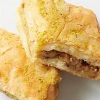 - Baklava · Layers of phyllo filled with chopped walnuts & cinnamon, drizzled with syrup & honey. (one p...