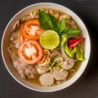 Pho Mommy · Lao Style Homemade Beef broth with Rice noodles,Thin slice eys-round beef,  meat balls,celer...