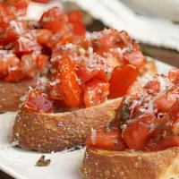 Bruschetta · Grilled Garlic Bread Topped with Tomatoes, Oil, Garlic, & Basil
