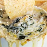 Spinach & Aritichoke Dip · Homemade Artichoke and Cheese Dip Served with Tortilla Chips