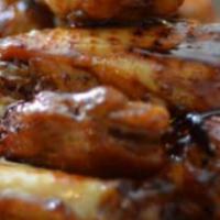 Wings - Teriyaki · premium breaded wings, cooked to perfection and smothered in teriyaki sauce  (approx. 7 wing...