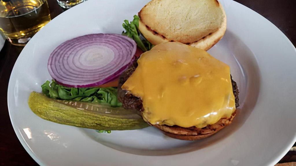 All American Burger · Our juicy 1/2 lb. Angus burger served with american cheese, lettuce, tomato, & onion
