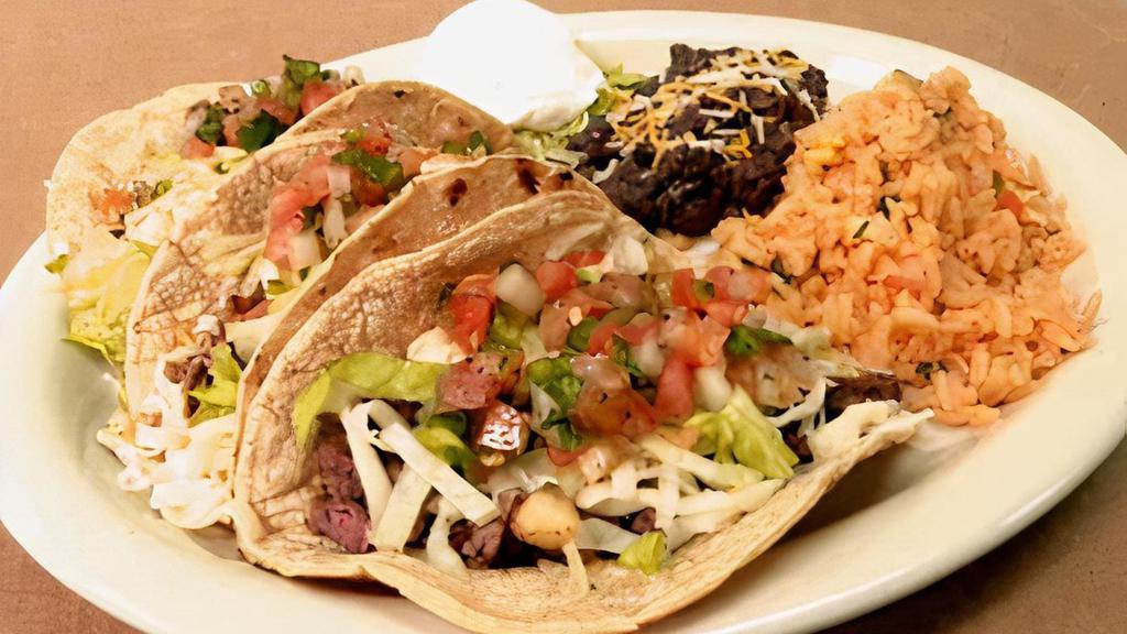 Taco Platter · Your choice of chicken, beef or fish in a flour tortilla topped with Pico de Gallo Served with a Side of Rice & Beans