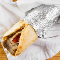 Gyro · Meat or chicken. Served with tzatziki sauce and greek pita.