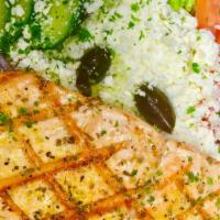 Char-Grilled Lemon Salmon Greek Salad · 8 oz chilean salmon chargrilled to perfection and spiced lightly set on top of our Greek sal...