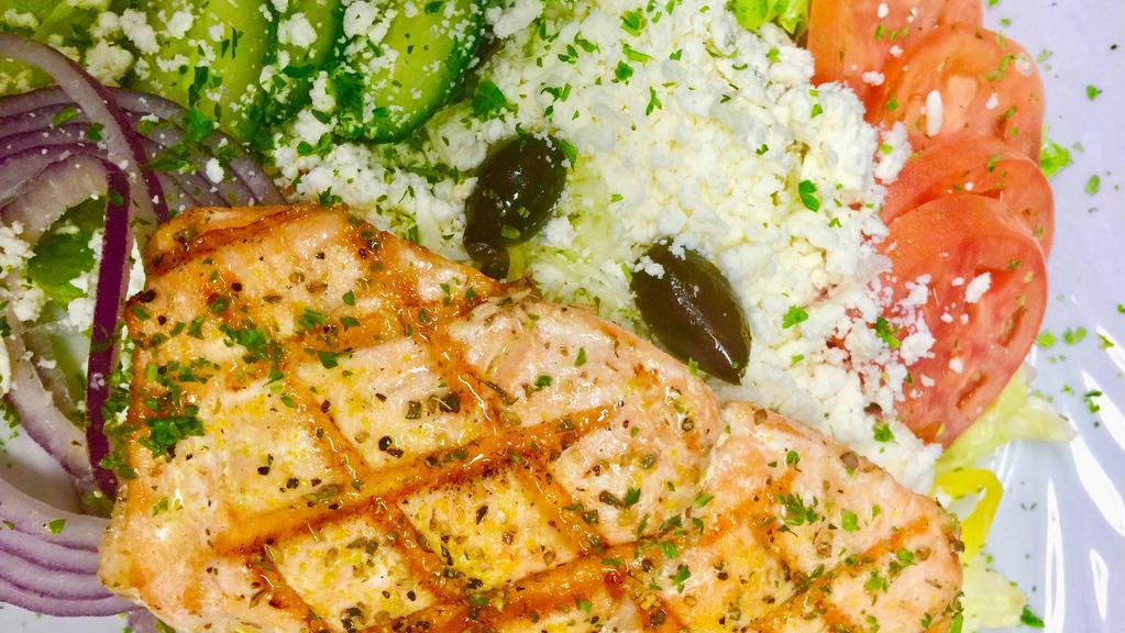 Char-Grilled Lemon Salmon Greek Salad · 8 oz chilean salmon chargrilled to perfection and spiced lightly set on top of our Greek salad.