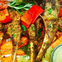 Pappou'S Lamb Chops W/ Greek Salad · 9 oz lamb chops marinated for at least for 48 hours then char-grilled to your liking set on ...