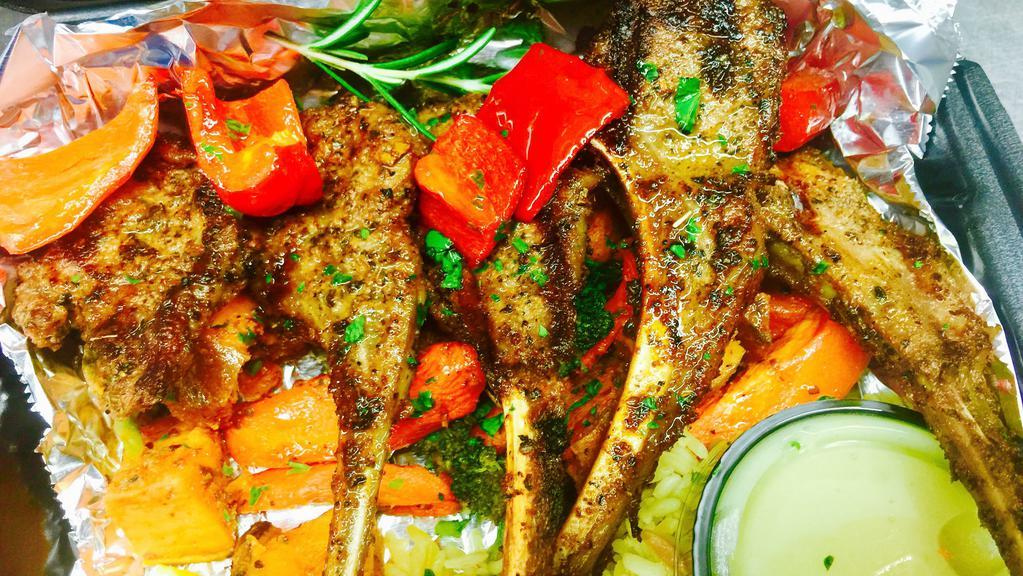Pappou'S Lamb Chops W/ Greek Salad · 9 oz lamb chops marinated for at least for 48 hours then char-grilled to your liking set on a bed of Greek country rice with a side of fresh roasted vegetables and our side of lemon dill sauce. Includes a small Greek Salad and a side of our homemade dressing