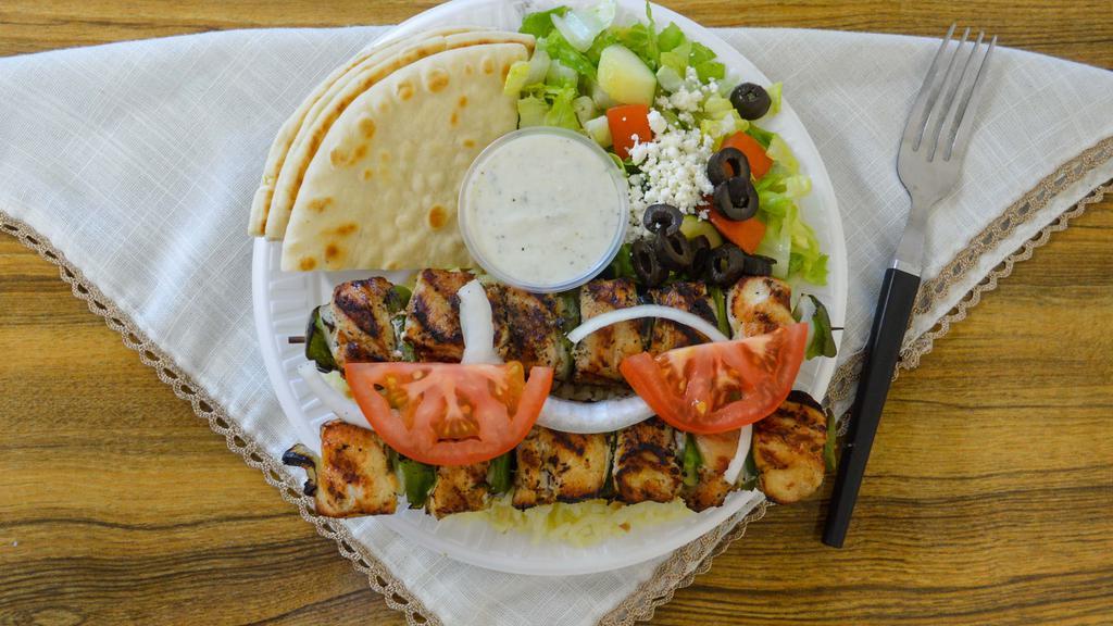 Chicken Kabob · A generous portion of chicken, marinated with Greek spices and chargrilled with red peppers, green peppers, and red onions. Set on a bed of Greek country rice with a side of our famous Greek dressing.