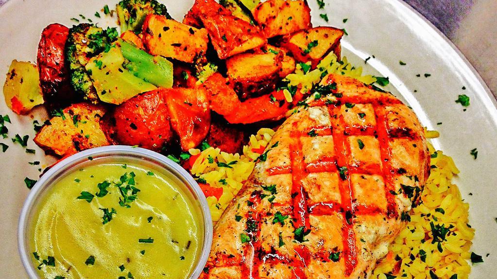Char-Grilled Lemon Salmon · Chilean salmon chargrilled to perfection, lightly spiced and set on a bed of Greek country rice with side of fresh roasted vegetables and a side of our lemon dill sauce.