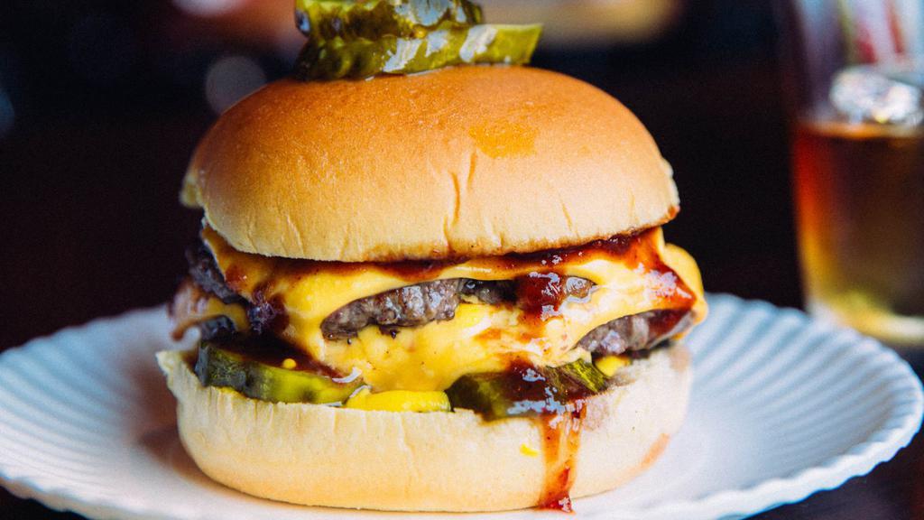 All American Double Burger · 2 all-beef patties with american cheese, bbq sauce, mustard, pickle & onion.