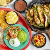 Lunch Fajitas · Chicken or Beef Fajitas served with shredded cheese and two sides