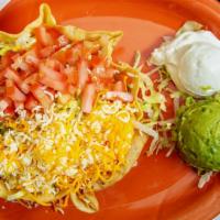 Taco Salad · A large flour tortilla shell loaded with your choice of beef and bean, chicken and rice or o...