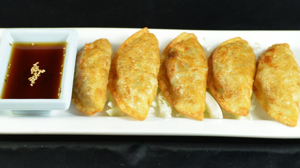 Gyoza (5) · Pan-fried pork dumplings.