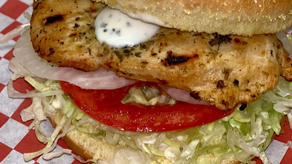 Gourmet Grilled Chicken Sandwich · A charbroiled chicken breast served on a toasted gourmet bun with garlic sauce, lettuce, tomato, and onion.