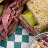 Corned Beef On Rye · Thin sliced, warmed corned beef and piled high on toasted rye bread, topped with mustard and...