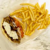 Hand-Carved Gyros · Hand-carved gyro slices Served with tomatoes, lettuce, grilled onions, and our homemade gyro...
