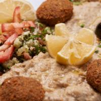 Maza Plate · Sampler of hummus, tabouli baba ghanouj, and falafel.