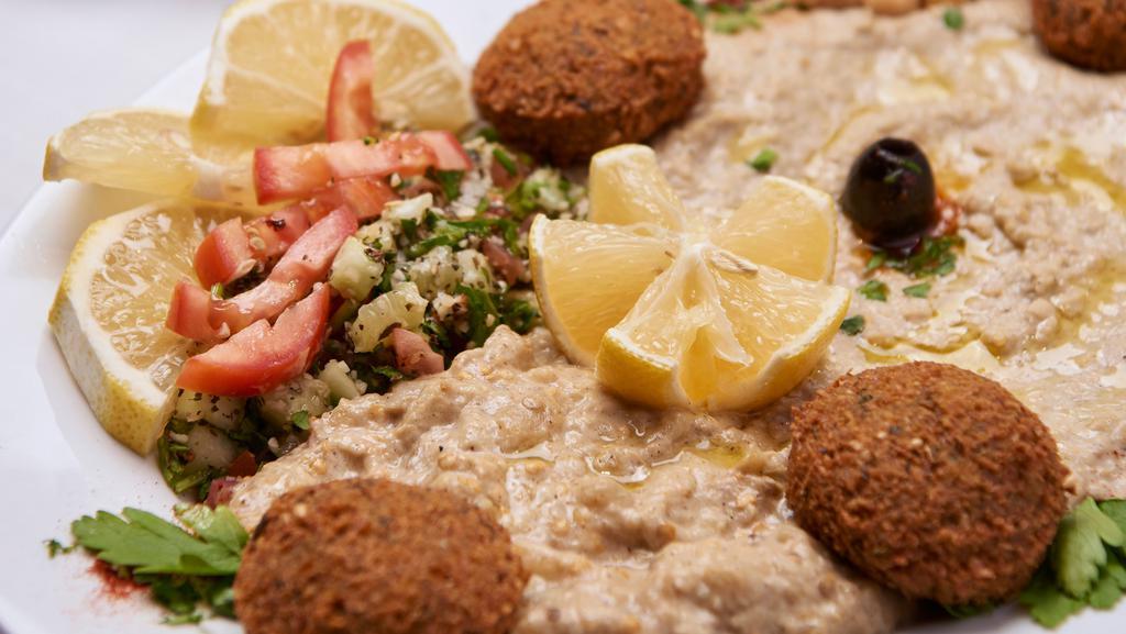 Maza Plate · Sampler of hummus, tabouli baba ghanouj, and falafel.