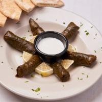 Dolmathes Platter · Six pieces of our homemade vegetarian dolmathes, served with your choice of sauce.