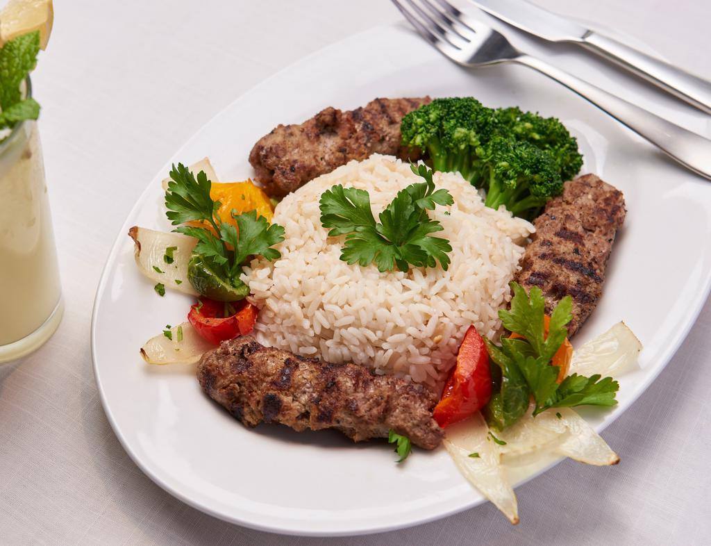 Kofta · Tender grilled ground lamb served over a bed of rice and your choice of sauce.