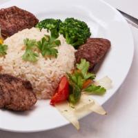 Beef Kabab · Professionally cut, seasoned, and grilled chunks of beef kabab served on a bed of rice and y...