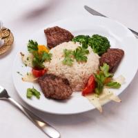 Parthenon Kabab (Lamb Kabab) · Grilled chunks of lamb kabab served with rice and your choice of sauce.