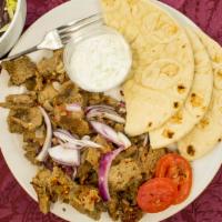 Gyro Plate · Gyro strips, served with onions, tomatoes, pita bread or rice, and your choice of sauce.