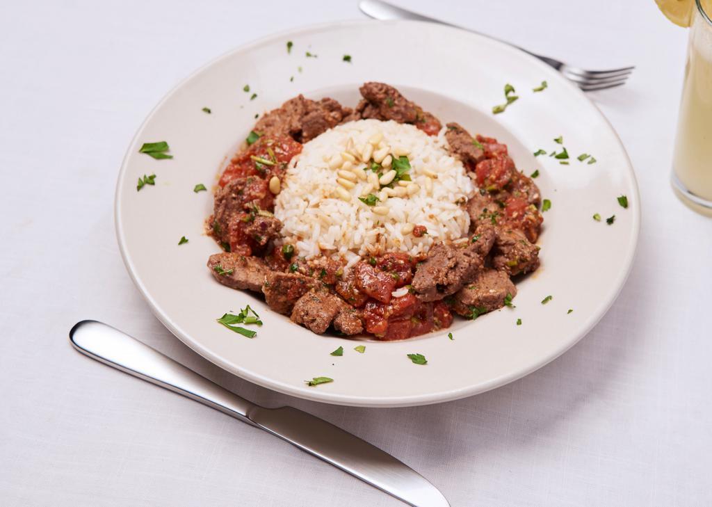 House With Lamb · Sautéed and marinated diced lamb with tomatoes house seasoning. Topped with pine nuts served over a bed of rice.