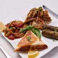 Athens Special · A sampler platter of spanakopita, dolmathes, moussaka (vegan) or (beef moussaka); served wit...