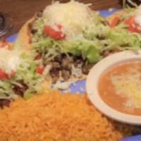 3 Taco Dinner · Topped with lettuce, and tomato. Served with rice and beans topped with cheese. Served on co...