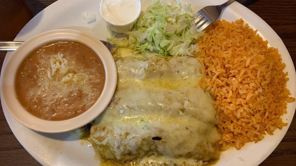 Enchiladas A La Plancha (3 Pieces) · Rolled up tortillas grilled in our mild red sauce and filled with cheese or available meat options. Served with side of rice and beans topped with cheese. Also comes with a side of sour cream.