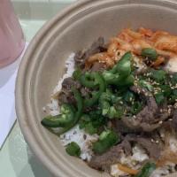 K-Town Beef Bulgogi Bowl · Rice, marinated korean beef bulgogi, carrot, sweet onion, scallions, sesame seeds and kimchi...