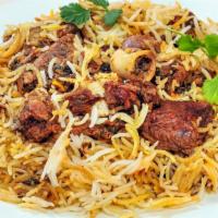 Dum Biryani Goat · Traditional Hyderabadi celebration meal-boned chicken cooked with spices and basmati rice.