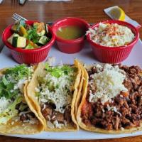 Three Taco Platter · Choose any three tacos. Served with a side of cilantro rice, chipotle black beans and salsa.